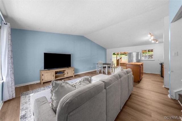9120 Pepperidge Rd, Chesterfield, VA 23236 - living room featuring vaulted ceiling, wood finished floors, and baseboards