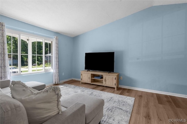 9120 Pepperidge Rd, Chesterfield, VA 23236 - living area with wood finished floors, baseboards, and vaulted ceiling