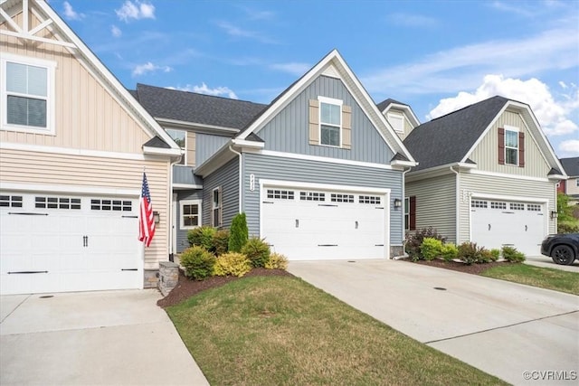 craftsman house with concrete driveway, board and batten siding, and stone siding