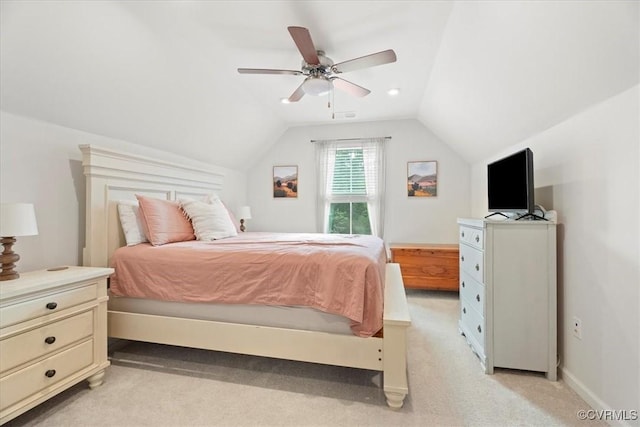 bedroom featuring vaulted ceiling, light colored carpet, ceiling fan, and baseboards
