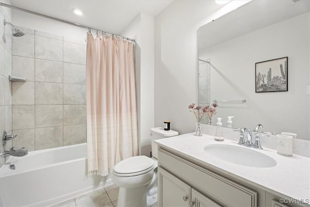 full bathroom with tile patterned floors, shower / bath combo, toilet, and vanity