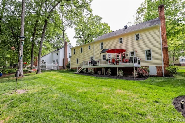4606 Oak Hollow Rd, Chester, VA 23831 - rear view of property with a wooden deck, a chimney, and a lawn
