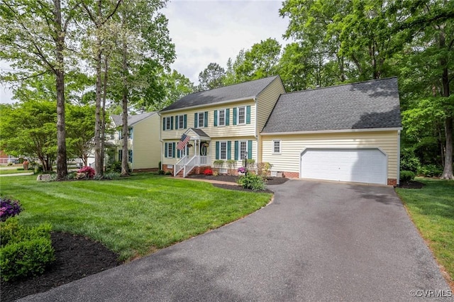 4606 Oak Hollow Rd, Chester, VA 23831 - colonial-style house featuring an attached garage, asphalt driveway, a front yard, and a shingled roof