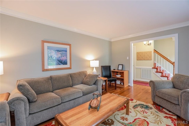 4606 Oak Hollow Rd, Chester, VA 23831 - living room with crown molding, wood finished floors, a chandelier, and stairway