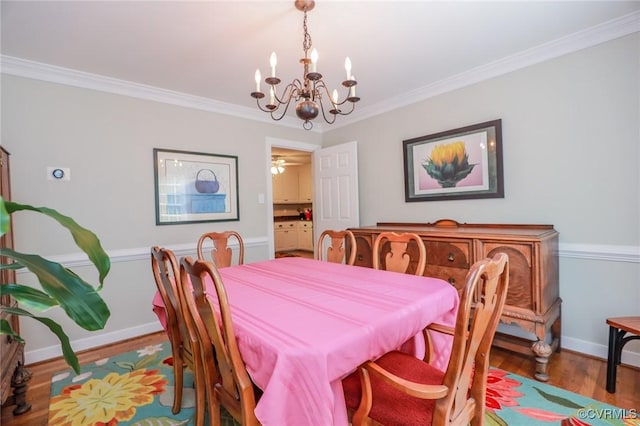 4606 Oak Hollow Rd, Chester, VA 23831 - dining room with a chandelier, crown molding, and wood finished floors