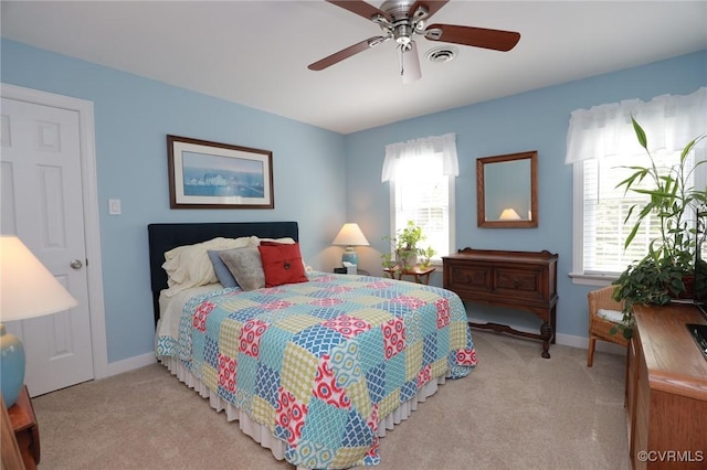 4606 Oak Hollow Rd, Chester, VA 23831 - bedroom featuring multiple windows, light colored carpet, and a ceiling fan