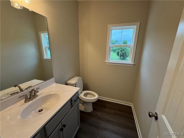 48 Cedar Hill Rd, Mineral, VA 23117 - half bathroom with healthy amount of natural light, wood finished floors, toilet, and baseboards