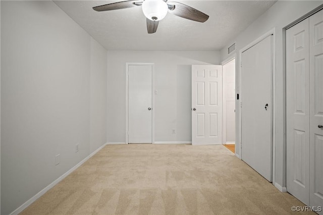 1503 Largo Rd Unit T3, Henrico, VA 23238 - unfurnished bedroom featuring light colored carpet, multiple closets, baseboards, and a ceiling fan