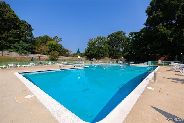 1503 Largo Rd Unit T3, Henrico, VA 23238 - community pool with fence, view of wooded area, and a patio area