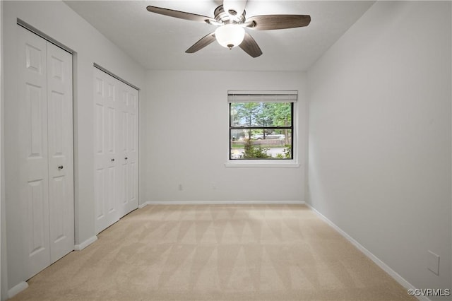 1503 Largo Rd Unit T3, Henrico, VA 23238 - unfurnished bedroom featuring light carpet, two closets, baseboards, and a ceiling fan