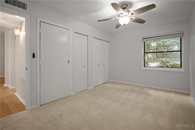 1503 Largo Rd Unit T3, Henrico, VA 23238 - unfurnished bedroom featuring multiple closets, carpet floors, baseboards, and ceiling fan