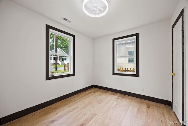 unfurnished bedroom featuring light wood finished floors and baseboards