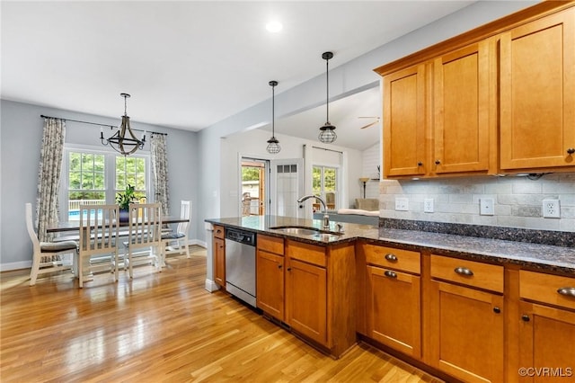 1845 Lower Mill Rd, Powhatan, VA 23139 - kitchen with a sink, stainless steel dishwasher, brown cabinetry, and baseboards