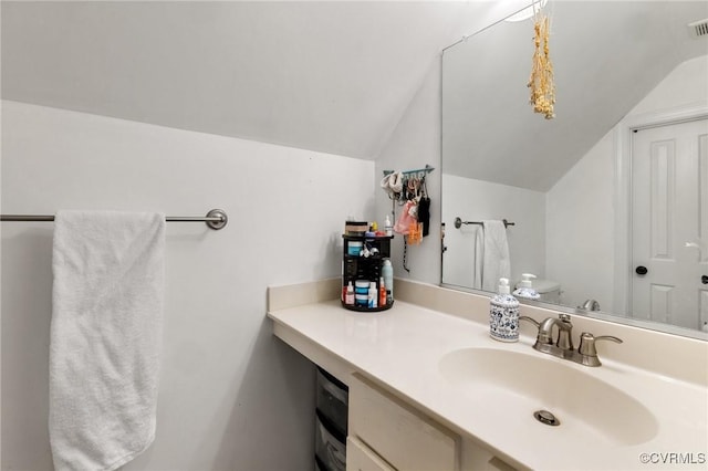 1845 Lower Mill Rd, Powhatan, VA 23139 - bathroom with lofted ceiling, vanity, and toilet