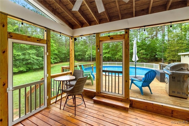 1845 Lower Mill Rd, Powhatan, VA 23139 - sunroom / solarium with hardwood / wood-style flooring, a wooden deck, wood ceiling, and view of wooded area