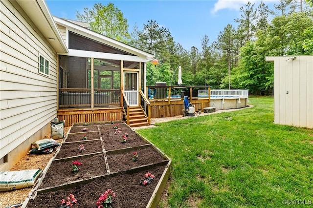 1845 Lower Mill Rd, Powhatan, VA 23139 - view of green lawn featuring a sunroom, an outdoor pool, a deck, and a vegetable garden