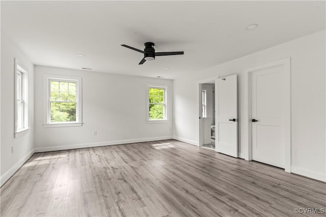 2001 Monteiro Ave, Richmond, VA 23222 - unfurnished bedroom with wood finished floors, baseboards, and a ceiling fan