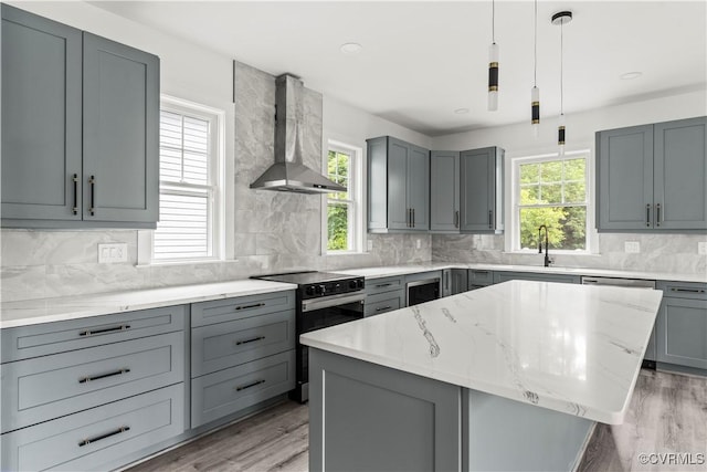 2001 Monteiro Ave, Richmond, VA 23222 - kitchen with black electric range oven, wall chimney range hood, gray cabinets, light stone counters, and recessed lighting