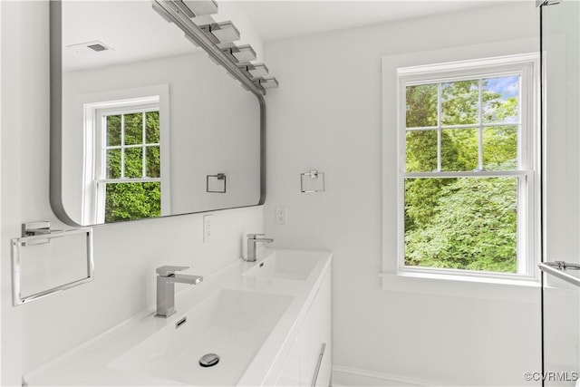 2001 Monteiro Ave, Richmond, VA 23222 - full bathroom featuring double vanity and baseboards