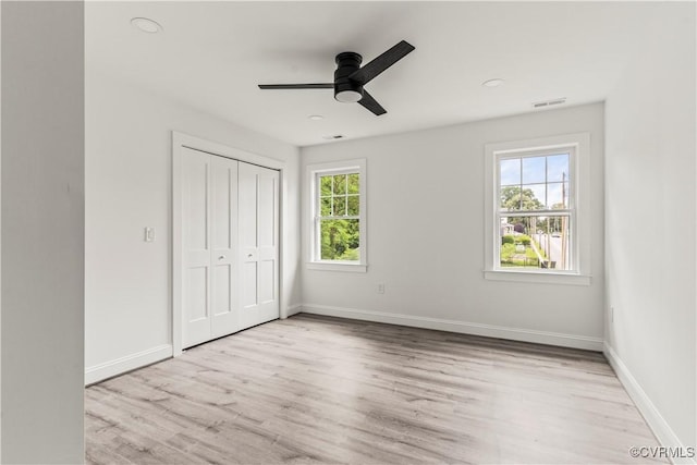 2001 Monteiro Ave, Richmond, VA 23222 - unfurnished bedroom with light wood-type flooring, a closet, and baseboards