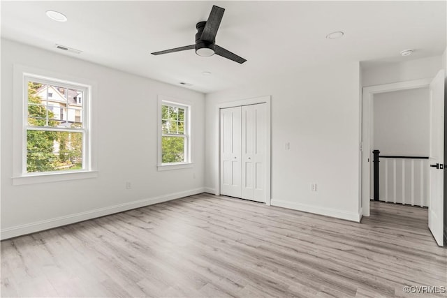 2001 Monteiro Ave, Richmond, VA 23222 - unfurnished bedroom with light wood-type flooring, baseboards, a closet, and ceiling fan