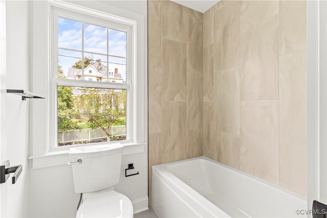 2001 Monteiro Ave, Richmond, VA 23222 - bathroom featuring healthy amount of natural light, toilet, baseboards, and bathtub / shower combination