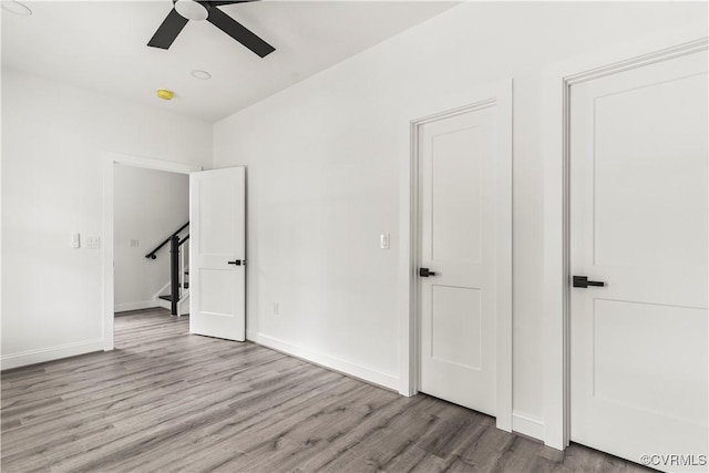 2001 Monteiro Ave, Richmond, VA 23222 - unfurnished room with wood finished floors, a ceiling fan, and baseboards