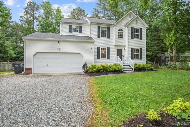 3190 Magnolia Woods Ter, New Kent, VA 23141 - view of front facade with driveway, a garage, and a front yard