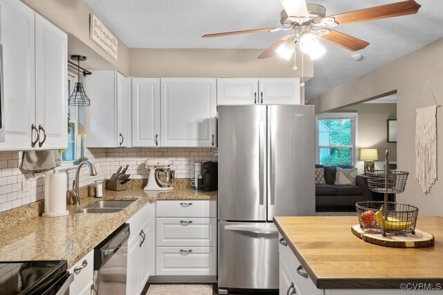 3190 Magnolia Woods Ter, New Kent, VA 23141 - kitchen with freestanding refrigerator, dishwasher, a sink, ceiling fan, and white cabinetry