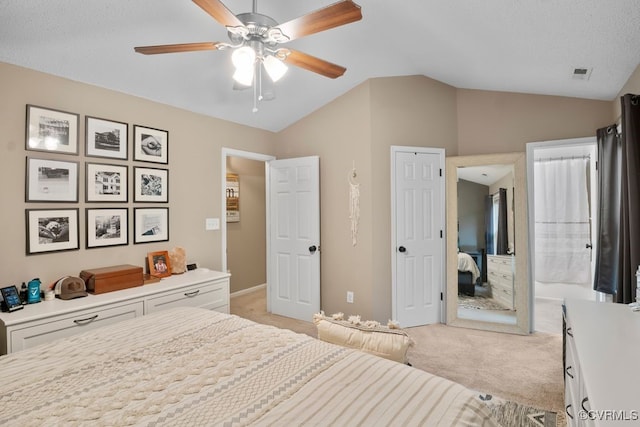 3190 Magnolia Woods Ter, New Kent, VA 23141 - bedroom featuring light colored carpet, vaulted ceiling, a ceiling fan, and connected bathroom