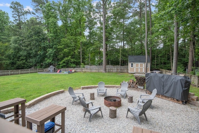 3190 Magnolia Woods Ter, New Kent, VA 23141 - view of patio with a storage shed, an outdoor fire pit, and an outbuilding