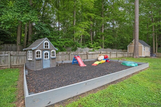 3190 Magnolia Woods Ter, New Kent, VA 23141 - view of jungle gym with a storage unit and an outbuilding