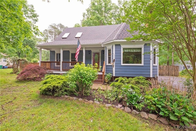 view of front facade featuring a porch and a shingled roof