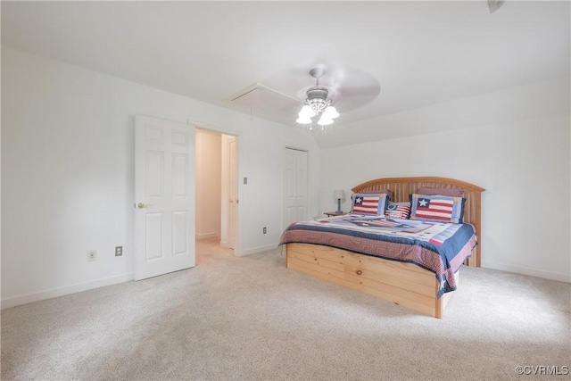 bedroom featuring carpet, attic access, baseboards, and a ceiling fan