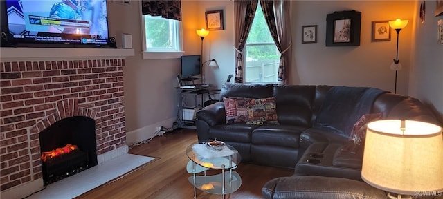 1024 W S Blvd, Petersburg, VA 23805 - living room with wood finished floors and a brick fireplace