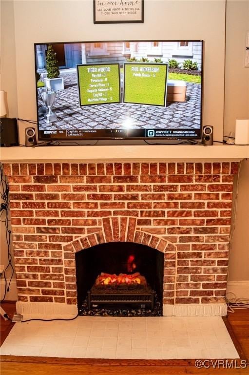 1024 W S Blvd, Petersburg, VA 23805 - detailed view of wood finished floors and a brick fireplace