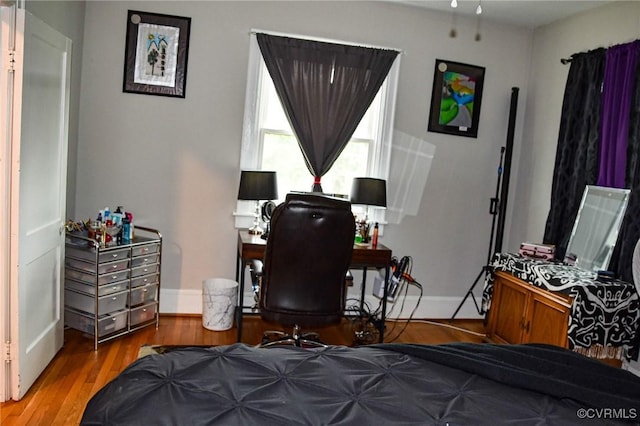 1024 W S Blvd, Petersburg, VA 23805 - bedroom with baseboards and wood finished floors
