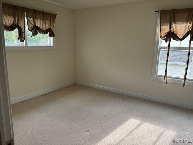 1919 Hounslow Ln, Manakin Sabot, VA 23103 - unfurnished room featuring light colored carpet, plenty of natural light, and baseboards