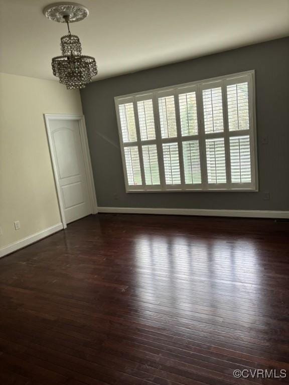 1919 Hounslow Ln, Manakin Sabot, VA 23103 - spare room with a chandelier, baseboards, dark wood finished floors, and plenty of natural light