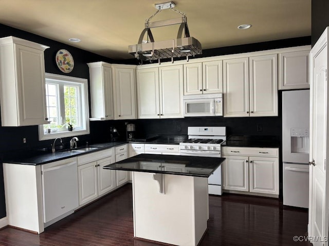 1919 Hounslow Ln, Manakin Sabot, VA 23103 - kitchen with white appliances, a sink, dark countertops, white cabinets, and recessed lighting
