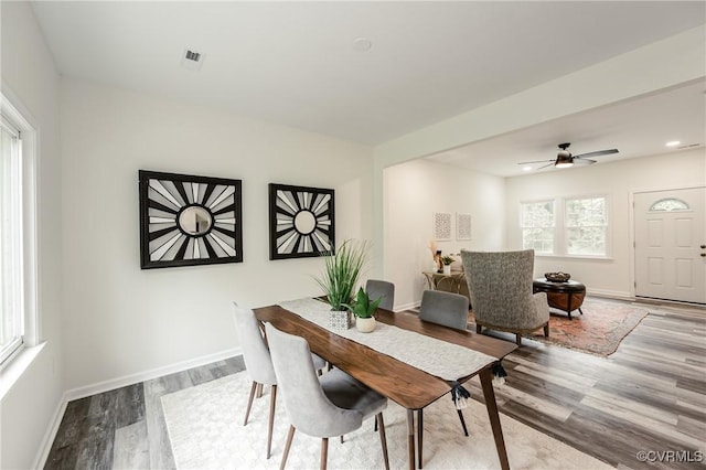 dining area with wood finished floors, baseboards, and a ceiling fan