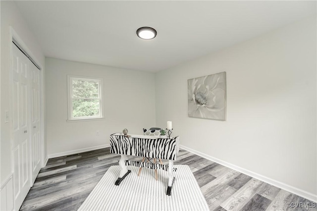 dining area featuring wood finished floors and baseboards