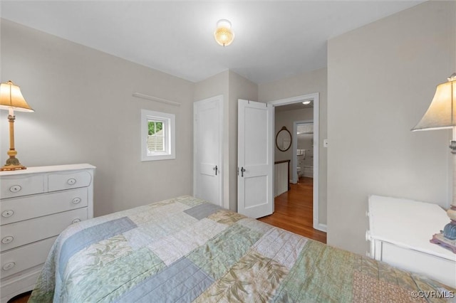 bedroom featuring wood finished floors