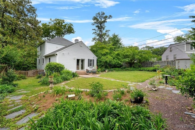 view of yard with entry steps and a patio area