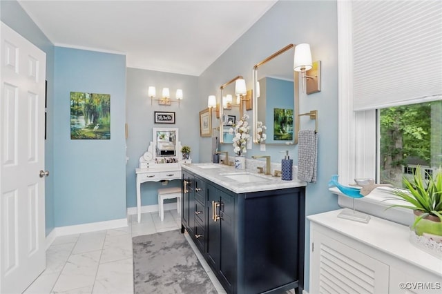 full bathroom featuring marble look tiles, a chandelier, double vanity, and baseboards