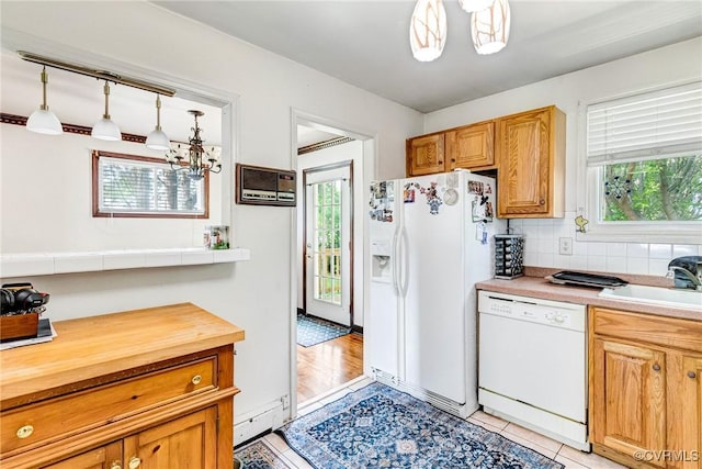 9301 Carlway Ct, Henrico, VA 23228 - kitchen with white appliances, a sink, healthy amount of natural light, and a chandelier