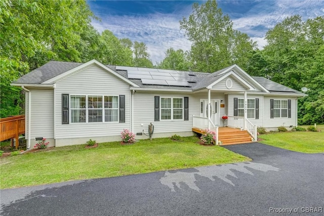 10402 Freewelcome Ln, Gloucester, VA 23050 - ranch-style home featuring solar panels, a front lawn, and roof with shingles