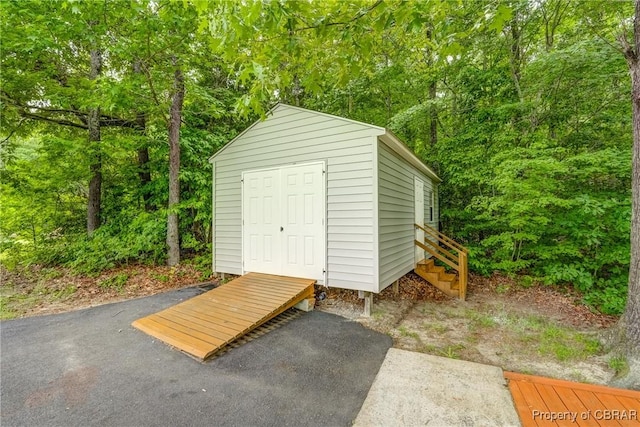 10402 Freewelcome Ln, Gloucester, VA 23050 - view of shed featuring a forest view