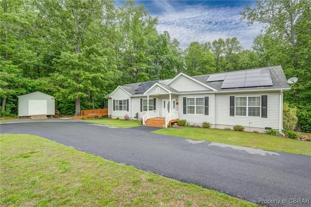 10402 Freewelcome Ln, Gloucester, VA 23050 - single story home with solar panels, a storage shed, an outbuilding, and a front yard