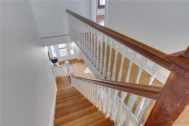 staircase with wood finished floors